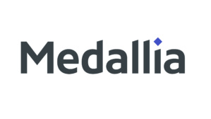 The image is the logo of Medallia, featuring the word "Medallia" in a modern font with a small blue diamond shape above the letter "i."